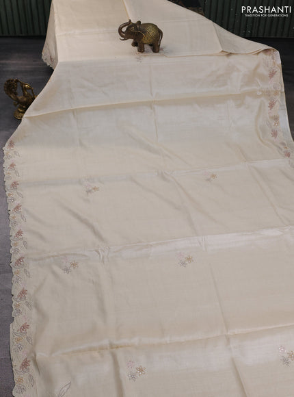 Pure tussar silk saree cream with plain body and floral embroidery border