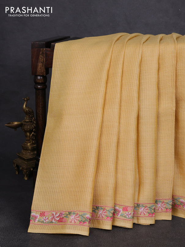 Pure tussar silk saree yellow shade with plain body and embroidery border