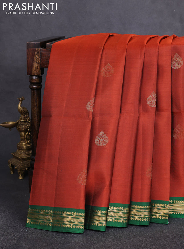 Pure soft silk saree rust shade and green with zari woven buttas and small zari woven border