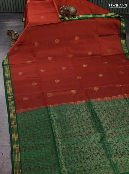 Pure soft silk saree rust shade and green with zari woven buttas and small zari woven border