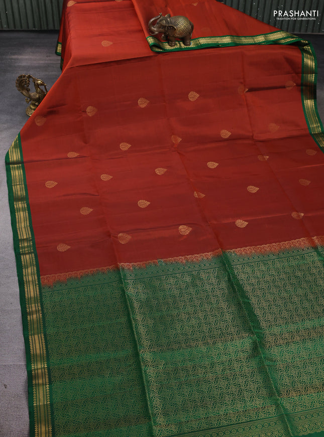 Pure soft silk saree rust shade and green with zari woven buttas and small zari woven border