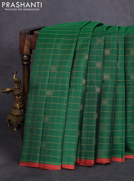 Pure soft silk saree dark green and rust shade with allover zari checks & buttas and piping border