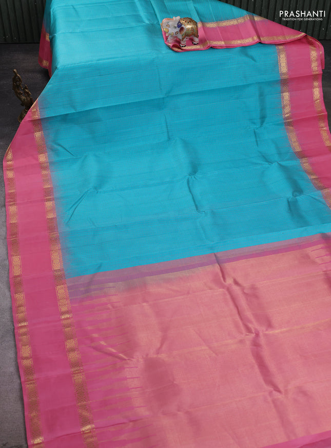 Pure soft silk saree teal blue and peach with allover checked pattern and rettapet zari woven border