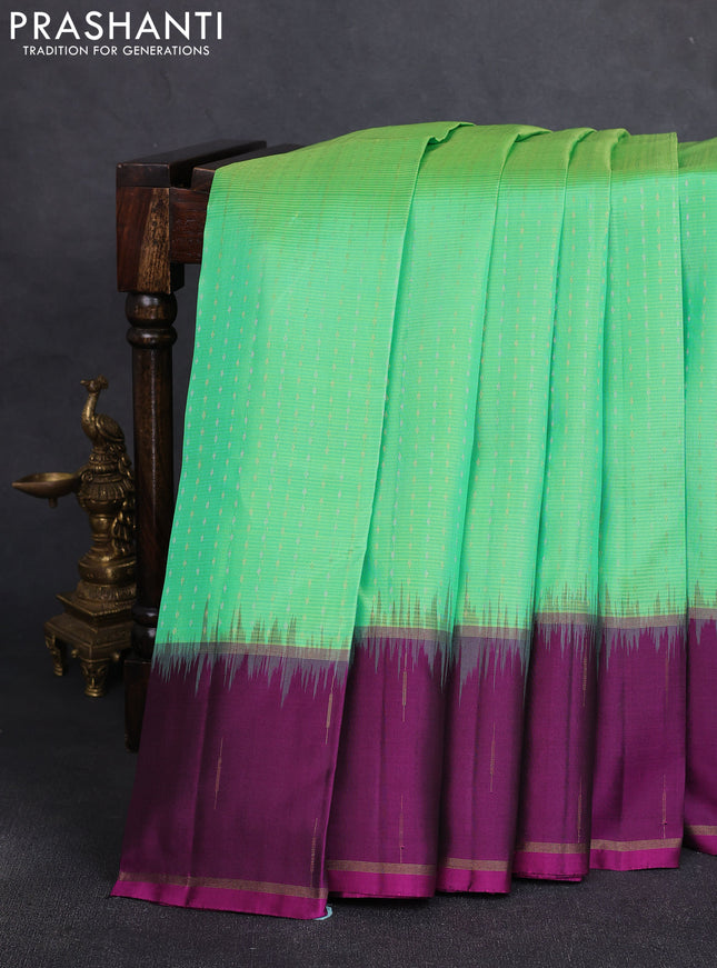 Pure soft silk saree light green and purple with allover silver & gold zari woven butta weaves and rettapet zari woven butta border
