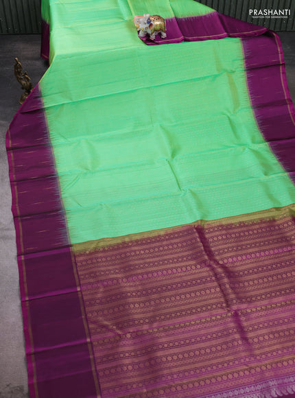Pure soft silk saree light green and purple with allover silver & gold zari woven butta weaves and rettapet zari woven butta border