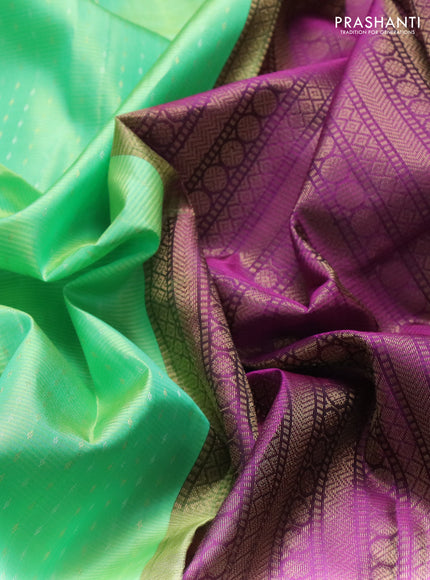 Pure soft silk saree light green and purple with allover silver & gold zari woven butta weaves and rettapet zari woven butta border