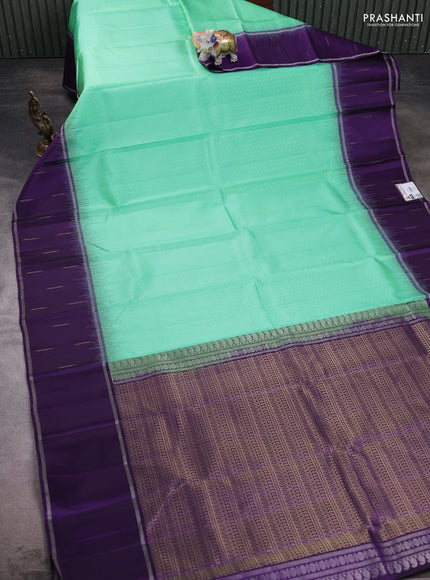 Pure soft silk saree teal green and violet with allover silver & gold zari woven butta weaves and rettapet zari woven butta border