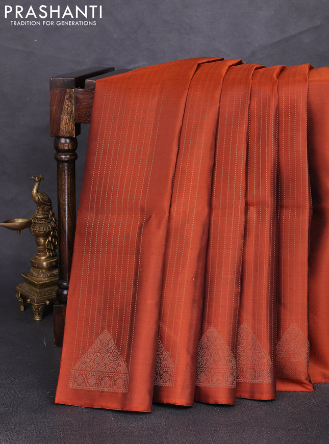 Pure soft silk saree rust shade and green with allover zari weaves & buttas in borderless style