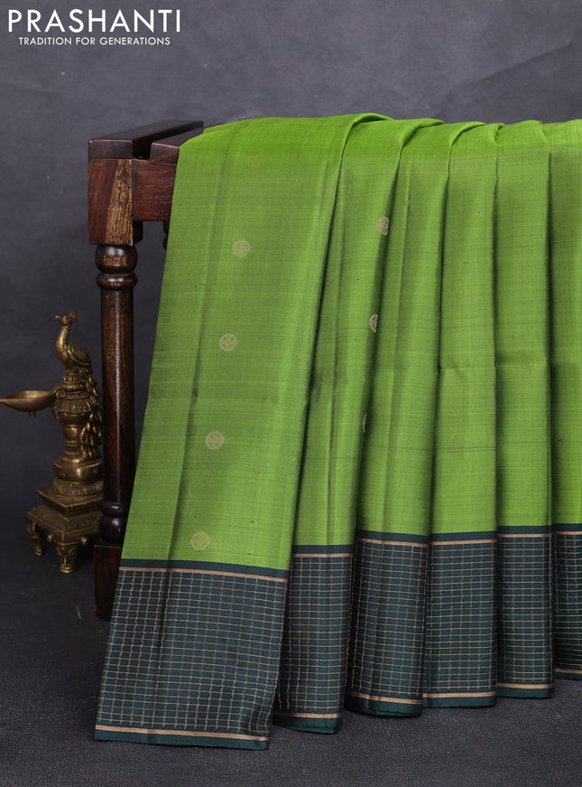 Pure soft silk saree light green and bottle green with zari woven buttas and zari woven checked border