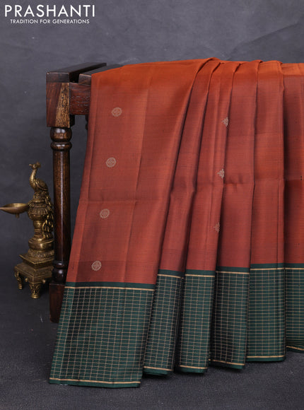Pure soft silk saree rust shade and bottle green with zari woven buttas and zari woven checked border