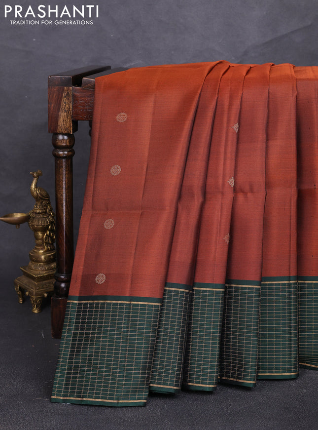 Pure soft silk saree rust shade and bottle green with zari woven buttas and zari woven checked border