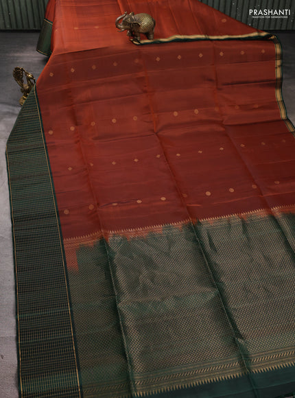 Pure soft silk saree rust shade and bottle green with zari woven buttas and zari woven checked border