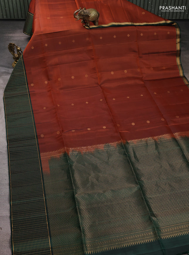 Pure soft silk saree rust shade and bottle green with zari woven buttas and zari woven checked border