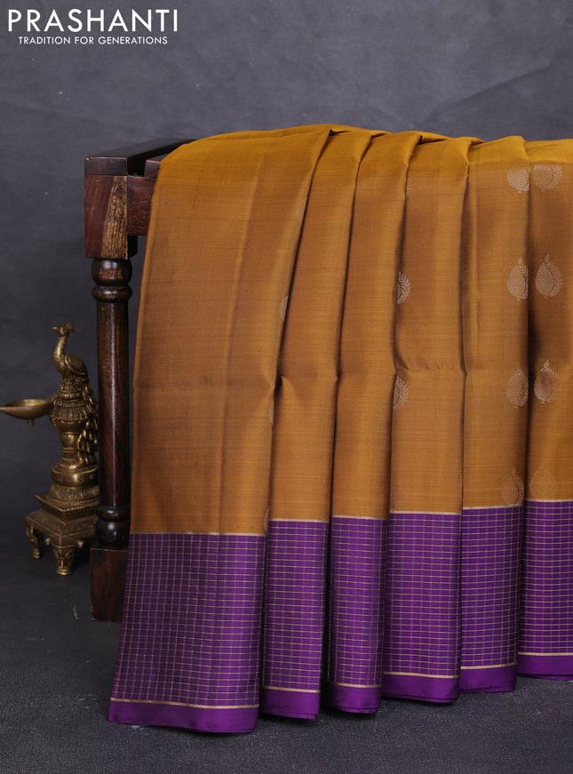 Pure soft silk saree dark mustard and purple with zari woven buttas and zari woven checked border