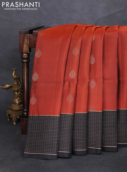 Pure soft silk saree rust shade and black with zari woven buttas and zari woven checked border