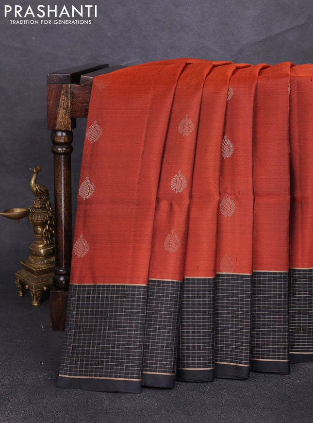 Pure soft silk saree rust shade and black with zari woven buttas and zari woven checked border