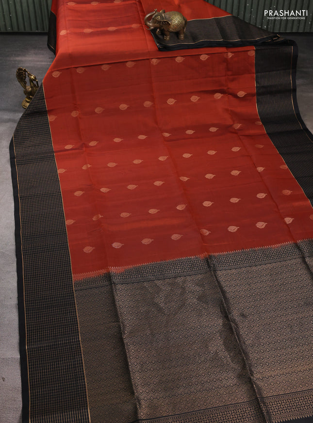 Pure soft silk saree rust shade and black with zari woven buttas and zari woven checked border