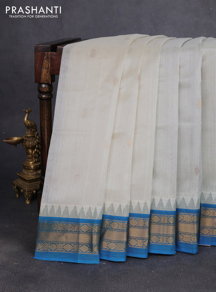 Silk cotton saree off white and cs blue with zari woven buttas and temple design zari woven korvai border