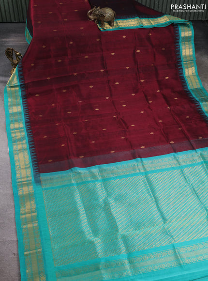 Silk cotton saree maroon and teal green with zari woven buttas and temple design zari woven korvai border