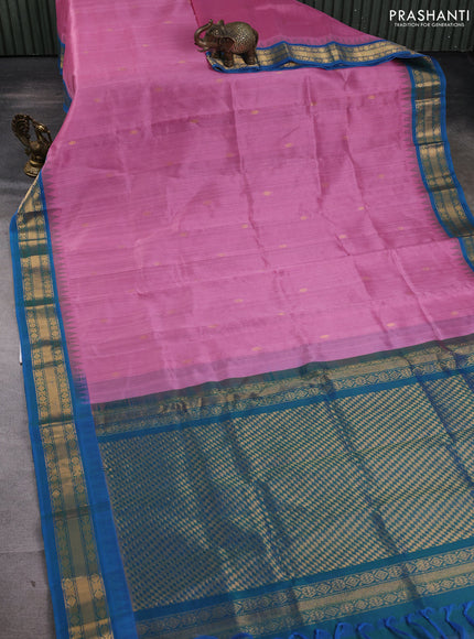 Silk cotton saree light pink and cs blue with zari woven buttas and temple design zari woven korvai border