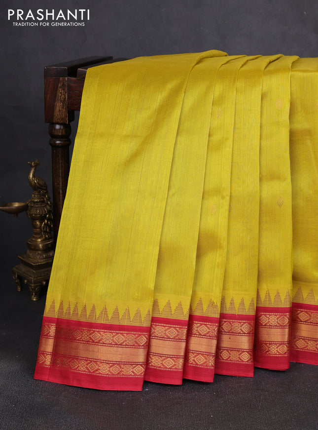 Silk cotton saree yellow and red with zari woven buttas and temple design zari woven korvai border