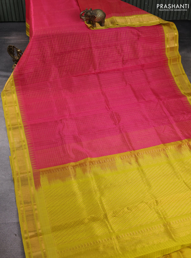 Silk cotton saree pink and lime yellow with allover zari woven checked pattern and temple design zari woven korvai border