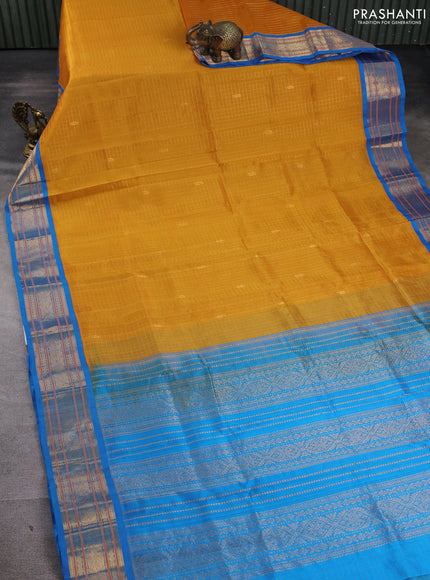 Silk cotton saree mango yellow and cs blue with allover zari checks & buttas and zari woven korvai border
