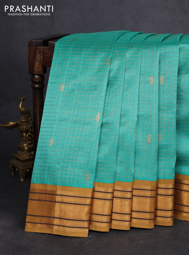 Silk cotton saree teal blue and dark ustard with allover zari checks & buttas and zari woven korvai border