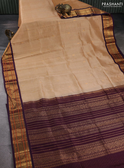 Silk cotton saree sandal and wine shade with allover zari checks & buttas and zari woven korvai border