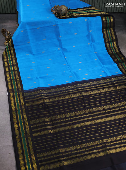 Silk cotton saree blue and black with paisley zari woven buttas and zari woven korvai border