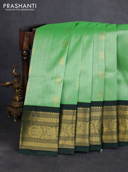 Silk cotton saree green and bottle green with zari woven buttas and long zari woven korvai border