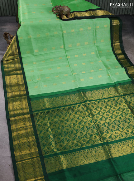 Silk cotton saree green and bottle green with zari woven buttas and long zari woven korvai border