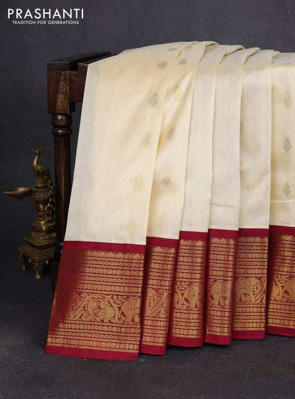 Silk cotton saree cream and maroon with zari woven buttas and long zari woven korvai border