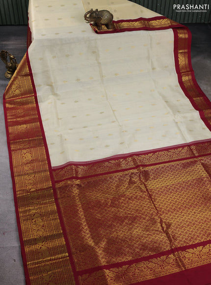 Silk cotton saree cream and maroon with zari woven buttas and long zari woven korvai border