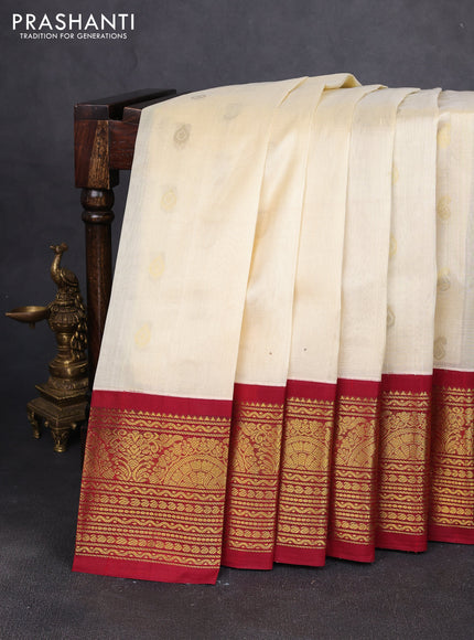 Silk cotton saree cream and maroon with zari woven buttas and long zari woven korvai border