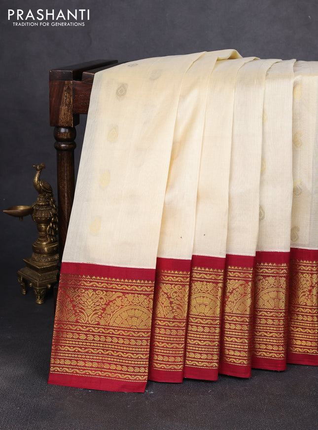 Silk cotton saree cream and maroon with zari woven buttas and long zari woven korvai border