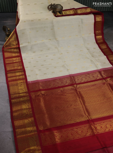 Silk cotton saree cream and maroon with zari woven buttas and long zari woven korvai border