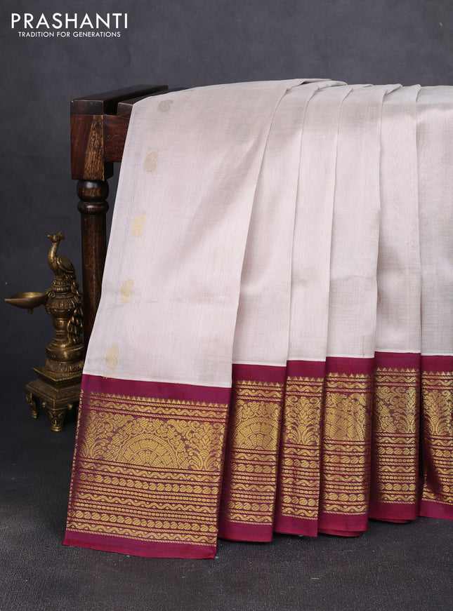 Silk cotton saree off white and wine shade with zari woven buttas and long zari woven korvai border