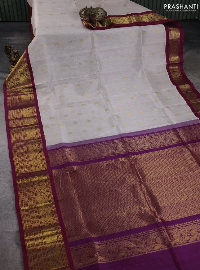 Silk cotton saree off white and wine shade with zari woven buttas and long zari woven korvai border