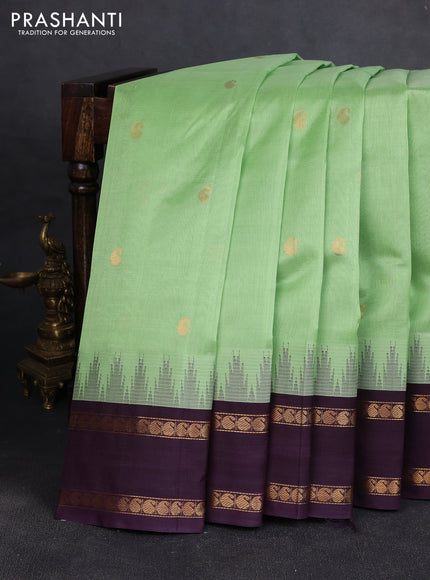 Silk cotton saree pista green and wine shade with paisley zari woven buttas and temple design rettapet zari woven korvai border