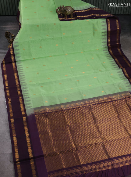 Silk cotton saree pista green and wine shade with paisley zari woven buttas and temple design rettapet zari woven korvai border