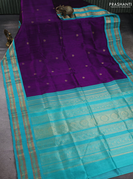 Silk cotton saree deep purple and teal blue with allover zari woven buttas and rettapet zari woven korvai border