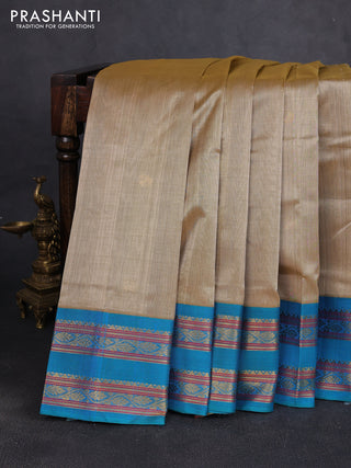 Silk cotton saree sandal and cs blue with paisley zari woven buttas and rettapet zari woven korvai border