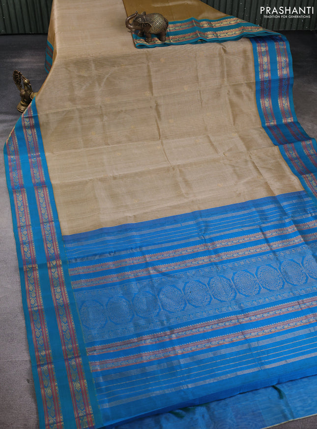 Silk cotton saree sandal and cs blue with paisley zari woven buttas and rettapet zari woven korvai border