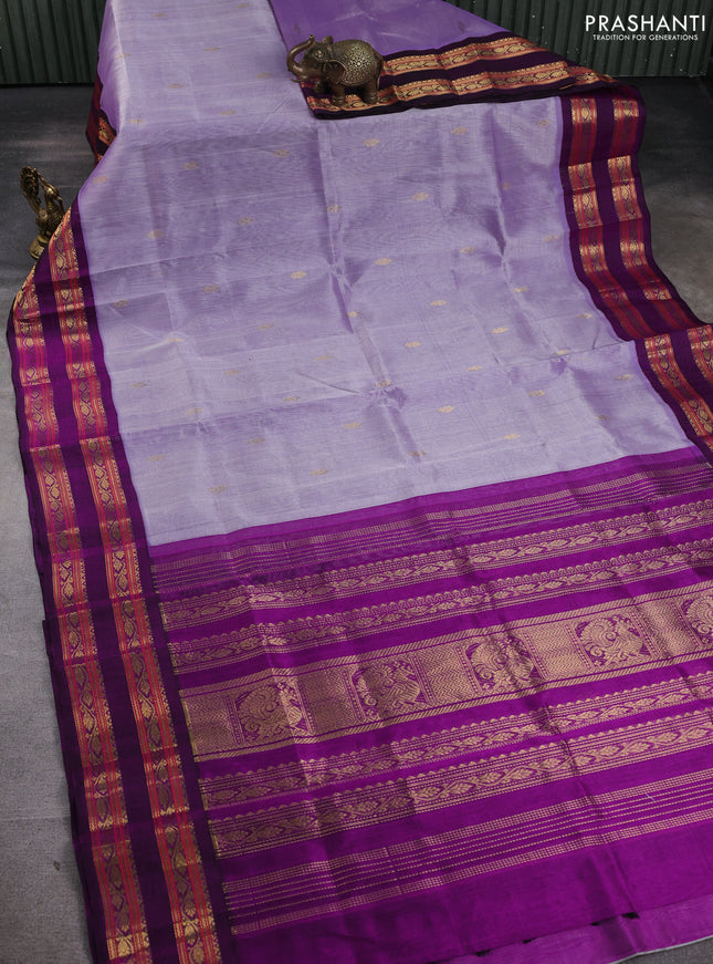 Silk cotton saree lavender and purple with allover zari woven buttas and rettapet zari woven korvai border