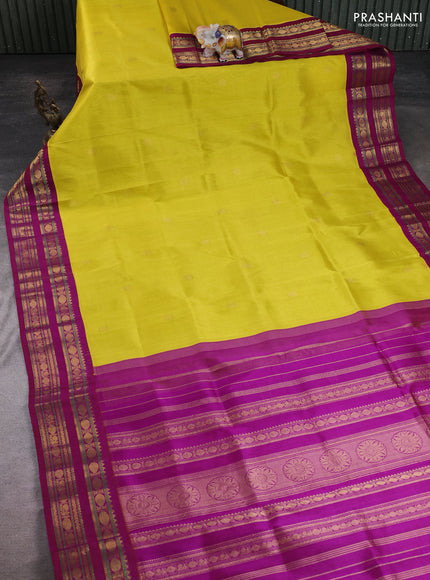 Silk cotton saree lime yellow and purple with paisley zari woven buttas and rettapet zari woven korvai border