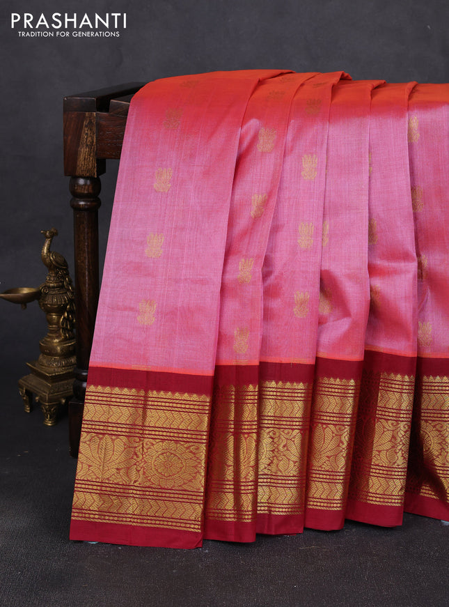 Silk cotton saree dual shade of pinkish red and maroon with allover zari woven buttas and long zari woven korvai border