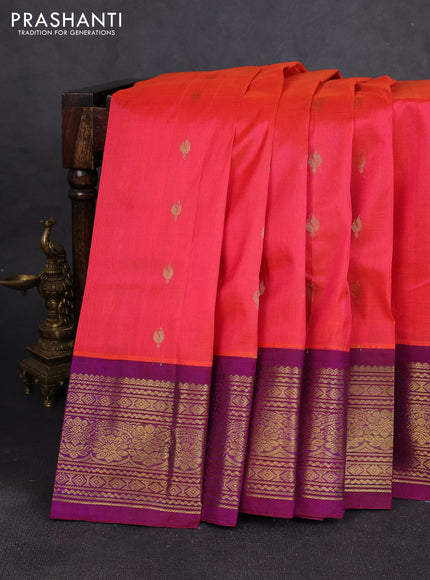 Silk cotton saree dual shade of pinkish orange and purple with allover zari woven buttas and long zari woven korvai border