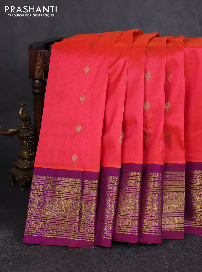 Silk cotton saree dual shade of pinkish orange and purple with allover zari woven buttas and long zari woven korvai border