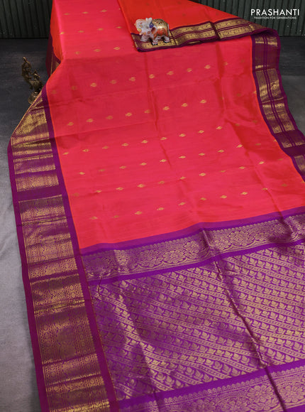 Silk cotton saree dual shade of pinkish orange and purple with allover zari woven buttas and long zari woven korvai border